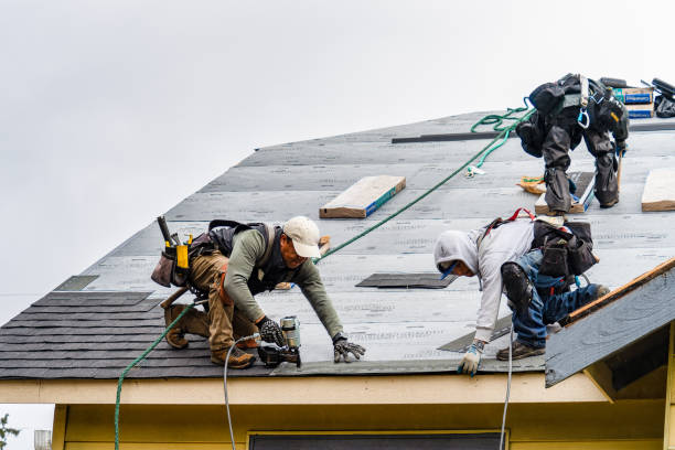 Professional Roofing technician working in South Kent, CT